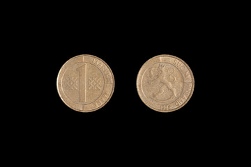 Old Finnish one markka coin. Black backgroung.