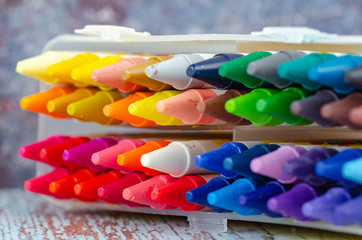 close up set mix color of crayons in the white box.selective focus shot