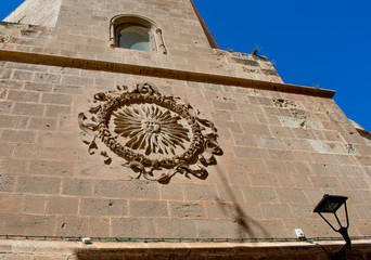 Almeria cathedral, in southern Spain, on a bright sunny day.  The sun symbol that represents the City.