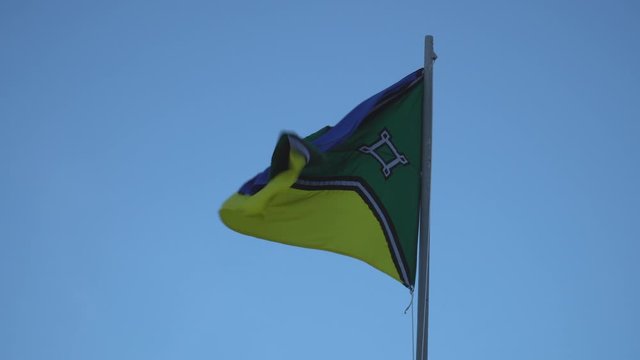 Beautiful flag of Amapa state waving in the wind on sunny summer day with blue sky. Concept of state, symbol, republic, Brazil, cultural identity, democracy, geography and politics.