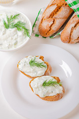Greek appetizer (salad) - tzatziki. Yogurt, fresh cucumbers and dark (buckwheat) bread (baguette).