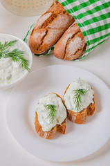 Greek appetizer (salad) - tzatziki. Yogurt, fresh cucumbers and dark (buckwheat) bread (baguette).