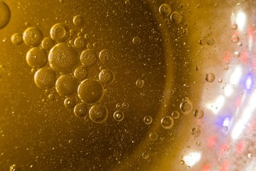 Biodiesel, bubbles biofuel, vegetable oil, yellow and orange emulsion bubbles background.