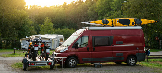 Fototapeta na wymiar Camper vans in a camping park 