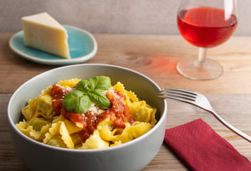 Fresh made delicious italian tortellini with arrabbiata sauce and cheese