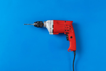 view from above of the simple single red drill work tool, copy space flat lay
