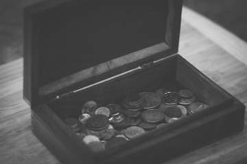 Vintage wooden vintage retro jewelry box with metal coins from different countries
