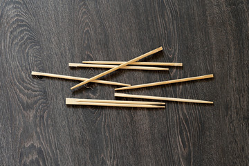 bunch of simple wooden chopsticks flat lay isolated on the table