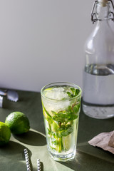 Cocktail mojito with lime, mint and ice. Recipe. Alcohol. Summer drink. Vegetarianism. Health.