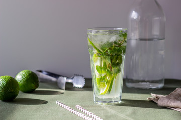 Cocktail mojito with lime, mint and ice. Recipe. Alcohol. Summer drink. Vegetarianism. Health.