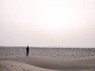 People enjoying the beauty of a desert 