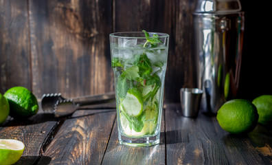 Cocktail mojito with lime, mint and ice. Recipe. Alcohol. Summer drink. Vegetarianism. Health.