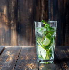 Cocktail mojito with lime, mint and ice. Recipe. Alcohol. Summer drink. Vegetarianism. Health.