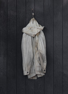 old worn jacket on a hanger