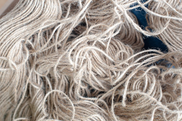 Light brown hemp yarn or rope The line is small Made in Asia Curled up together in a basket Used for devices invention Knitting Machine Creates good warmth Wearing a clear, comfortable feeling