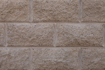 Gray brick wall. Torn concrete structure. Creative vintage background.