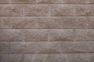 Gray brick wall. Torn concrete structure. Creative vintage background.