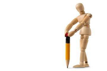 Wooden mannequin writing something on white background