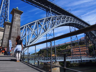 Young woman with Dom Luis I Bridge, Porto, Portugal