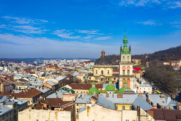 Fototapeta premium Aerial view on Dominican Church and Dormition Church in Lviv, Ukraine from drone