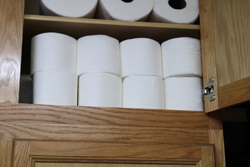 Toilet Paper reserves stockpiled on shelf