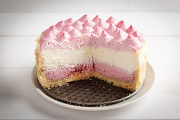 Delicious homemade cheesecake with berries on wooden table.