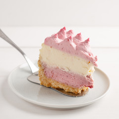 Delicious homemade cheesecake with berries on wooden table.