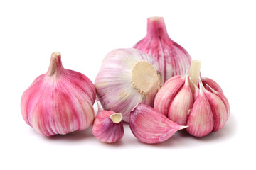 Garlic press and garlic on white background 
