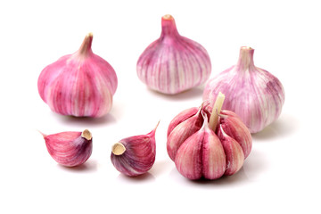 Garlic press and garlic on white background 