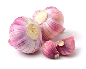 Garlic press and garlic on white background 