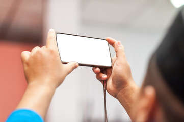 Young Asian Muslims use a mobile phone to take pictures surprisingly during the event that is happening Happily to pass on happiness to friends who communicate in the social world to know