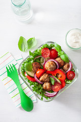 keto paleo lunch box with meatballs, lettuce, tomato, cucumber, bell pepper