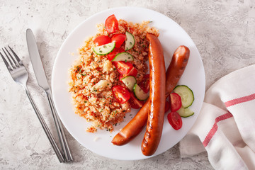 ketogenic paleo diet lunch. cauliflower rice and grilled sausages