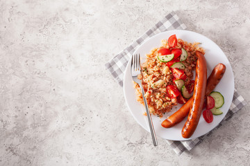 ketogenic paleo diet lunch. cauliflower rice and grilled sausages