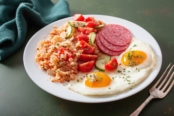 ketogenic paleo diet breakfast. cauliflower rice, fried egg salami
