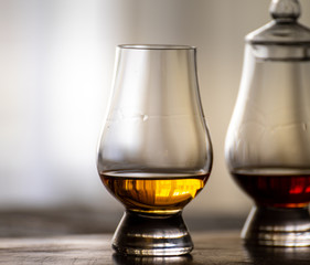 Tasting of flight of Scotch whisky from special tulip-shaped glasses on distillery in Scotland, UK