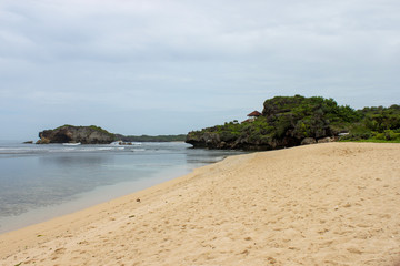 views of white sand with calm waves