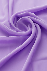 Macro shot of a lavender color viscose fabric lined as a large semi-transparent flower.  