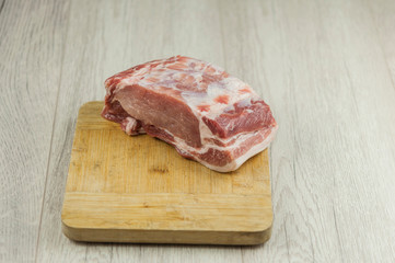 Raw pork meat on wood cutting board