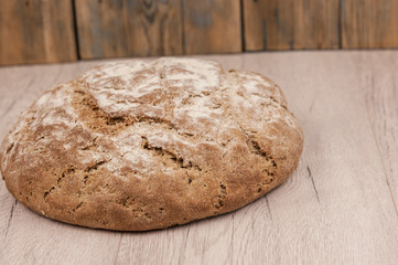 Round loaf of freshly backed sourdough bread, with copy space