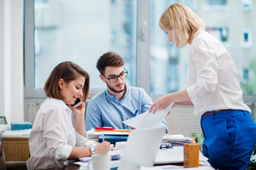 Team of architects working in the office	