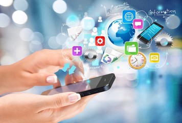 Human hands hold a mobile phone