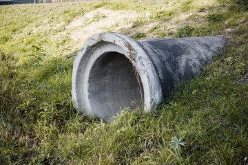Sewer gutter brought to the field. Drainage of the road. Ecological problem. Environmental...