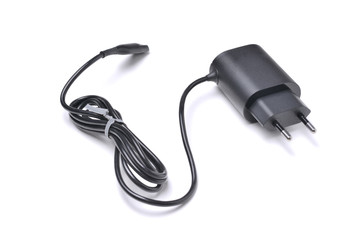 Charger for gadgets in black with cable and connector, isolated on a white background with a shadow