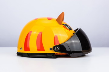 Cute tiger motorcycle helmet with wind shield and sun visor, classic helmet isolated on white...