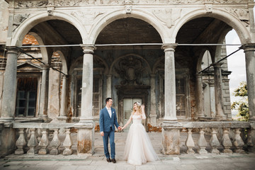 Wedding couple holding hands, groom and bride together on wedding day