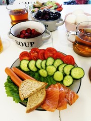 Sausages with vegetables for breakfast. Cucumber and croutons on a plate