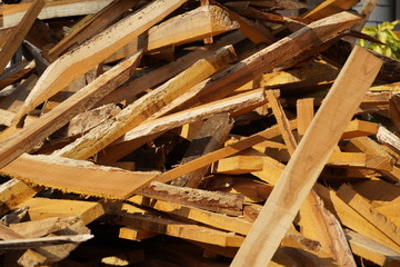 Broken long chunks of tree trunk. Close up broken pieces of wood. Pine timber wood chip. Broken into pieces and splinters solid tree trunk, close-up from the place of harvesting wood.