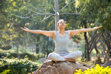 Beautiful woman exercising at park