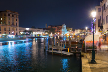 Fototapeta premium Canals of Venice city with beautiful architecture at night, Italy